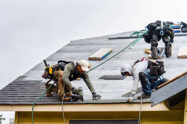 Professional Gutter Installation technician working in Saint John, IN